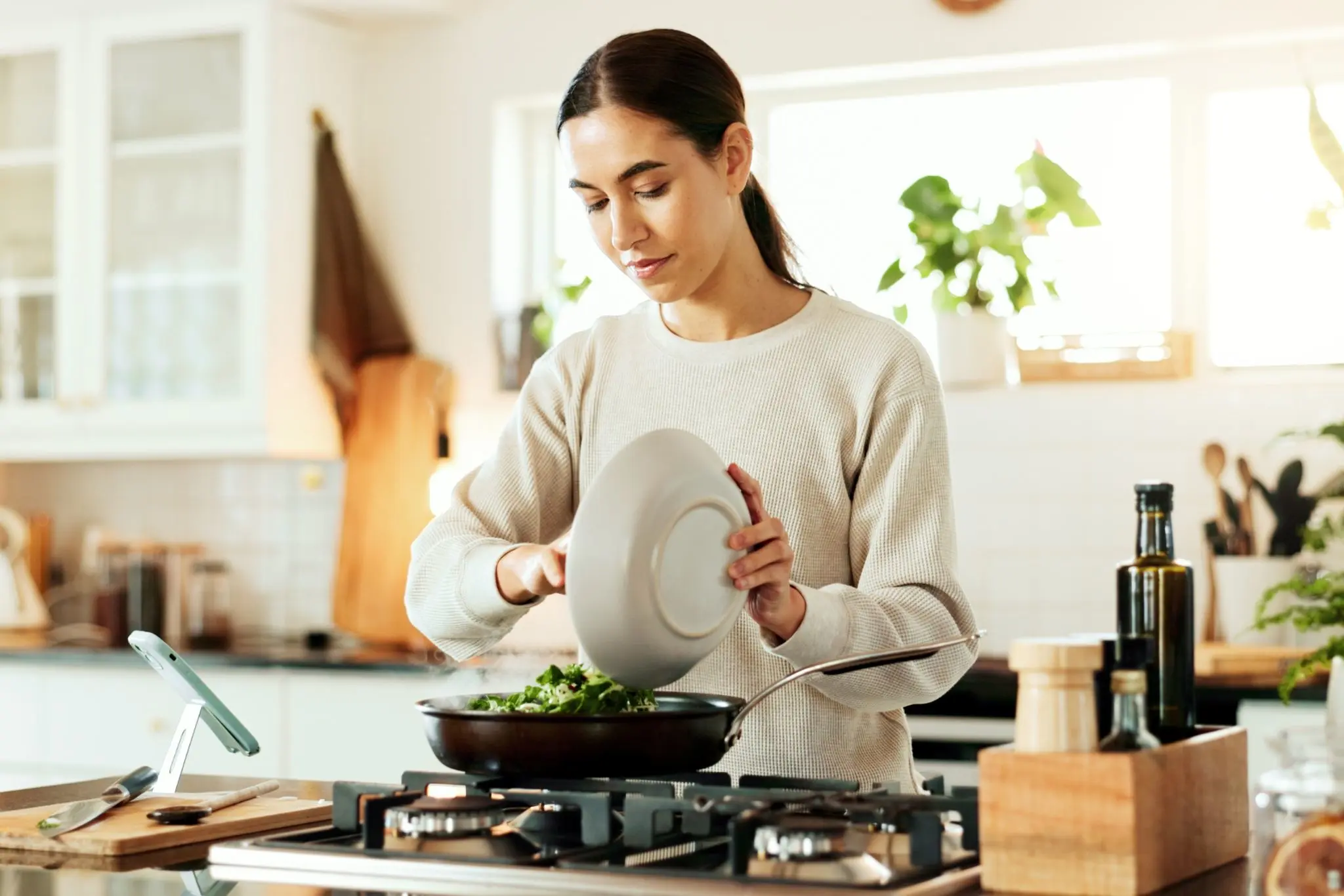 Woman cooking vegetables