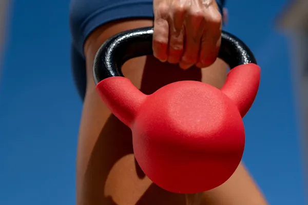 Woman holding kettlebell