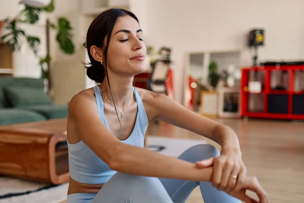 Woman sitting with eyes closed