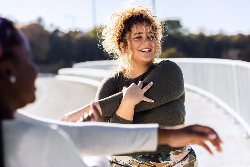Woman stretching on bridge